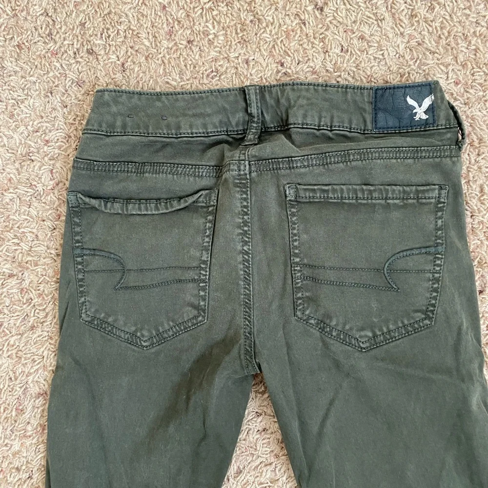 American Eagle Distressed Green Jeggings size 2